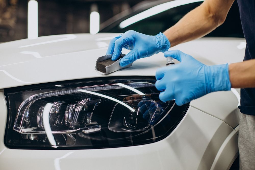 Polishing the hood of a car by hand